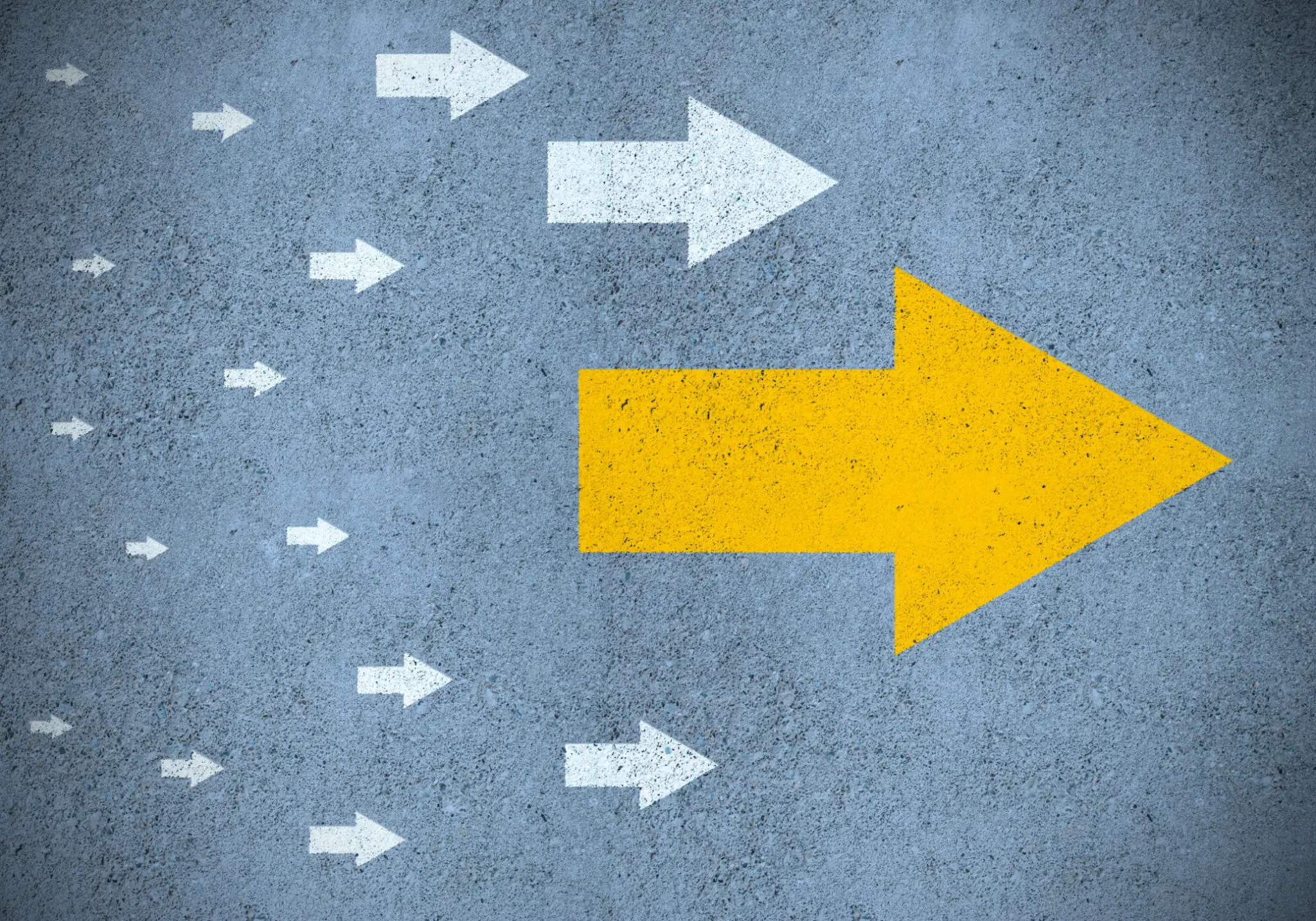 Large yellow arrow among smaller white arrows